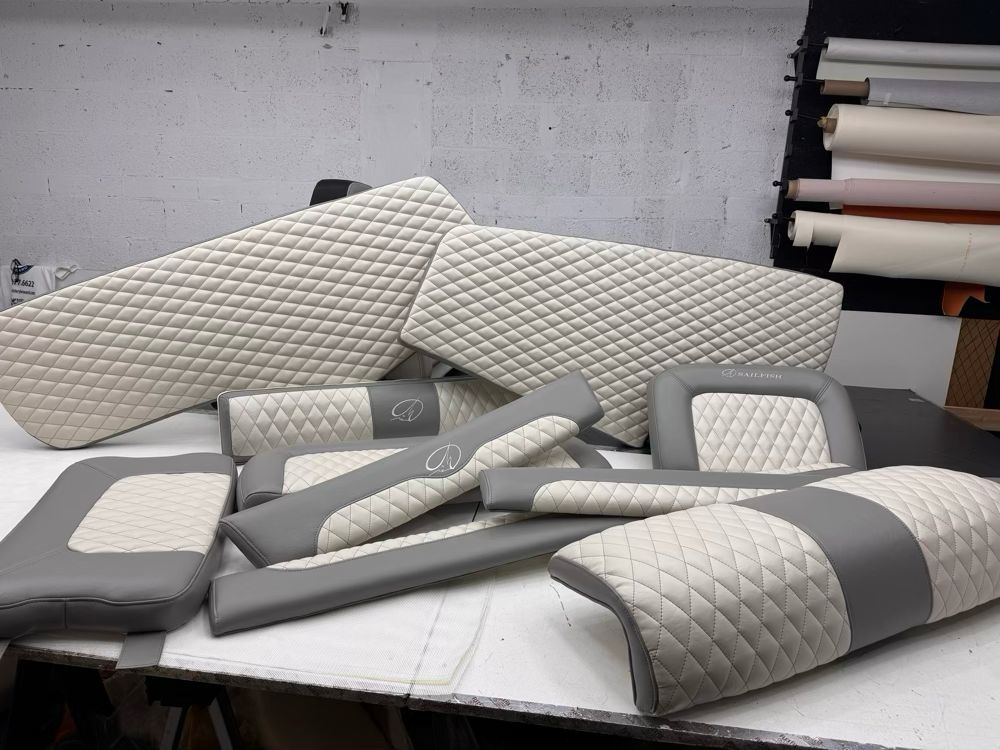Assorted quilted upholstery pieces stacked for Sailfish boat