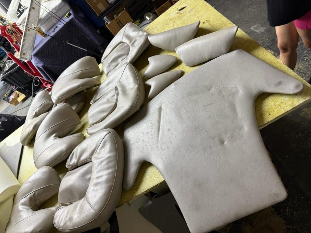 Old SeaDoo seat cushions before custom marine upholstery rebuild
