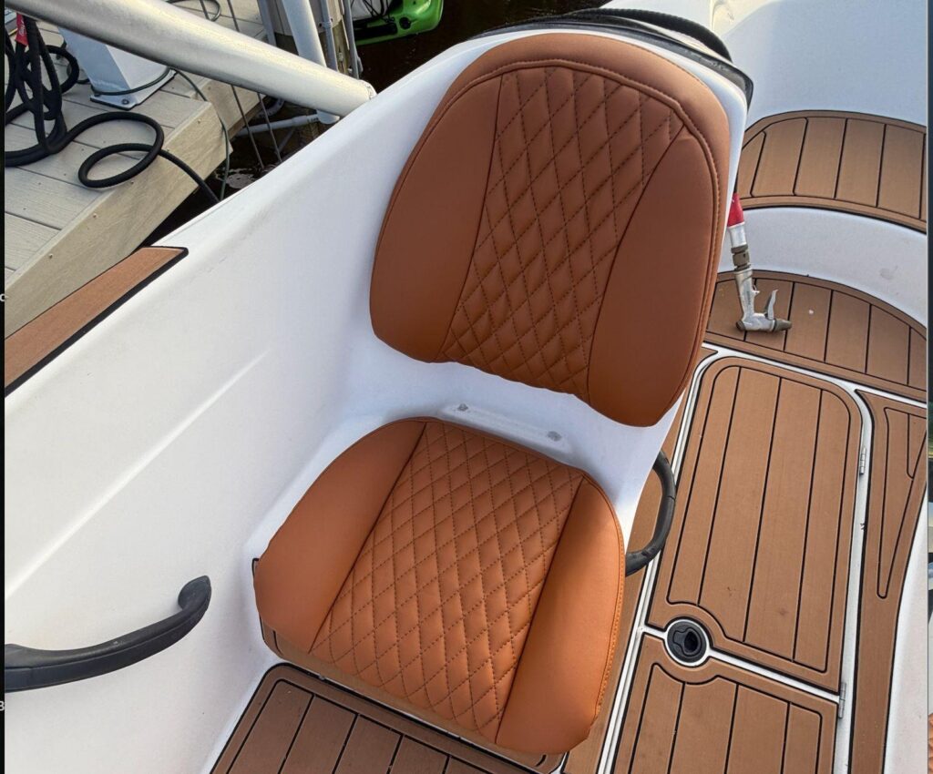 New SeaDoo seat installed with brown diamond stitching and thicker cushion support