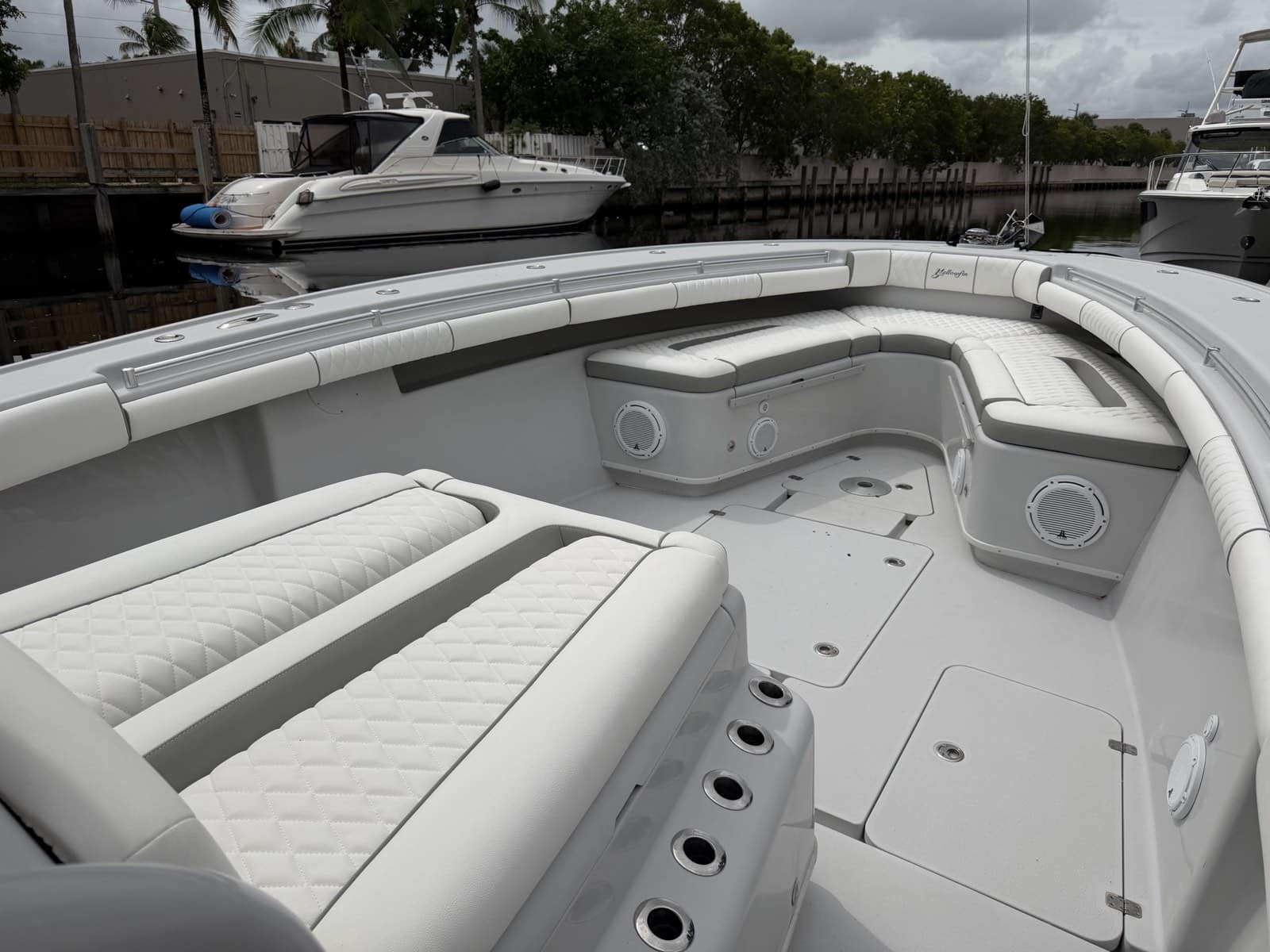 Completed Yellowfin bow seating and bolsters with white upholstery, gray accents and diamond stitching