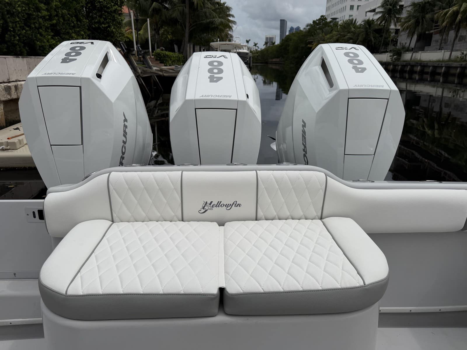 Finished Yellowfin stern bench with white diamond-stitched cushions, gray trim and embroidered backrest